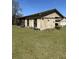 A front view of an outbuilding surrounded by a grassy yard at 7819 Bells Hwy, Ruffin, SC 29475