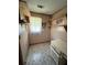 Small room features linoleum flooring, built-in shelving and storage, plus a window at 7819 Bells Hwy, Ruffin, SC 29475