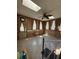 Sunlit room with tile flooring, wood paneling, skylight, and fan at 7819 Bells Hwy, Ruffin, SC 29475