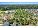 Aerial view of Carnes Crossroads neighborhood and community pool area with green common spaces and mature trees at 804 Buckler St, Summerville, SC 29486