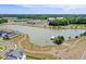 Panoramic aerial view of a community with a large lake, green spaces, and various amenities at 804 Buckler St, Summerville, SC 29486