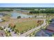 Community aerial view featuring a soccer field, neighborhood lake, recreational park and winding roadways at 804 Buckler St, Summerville, SC 29486