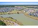 Stunning aerial perspective of a community featuring a lake, walking paths, and beautifully landscaped surroundings at 804 Buckler St, Summerville, SC 29486