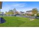 Spacious, green backyard with a black picket fence surrounding the perimeter and a wood garden bed at 804 Buckler St, Summerville, SC 29486