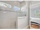 Modern bathroom featuring a sleek glass-enclosed shower and tiled walls at 804 Buckler St, Summerville, SC 29486