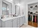 Clean, bright bathroom with double sinks, ample counter space, and walk-in closet at 804 Buckler St, Summerville, SC 29486