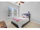 Cozy bedroom features a comfortable bed, plush carpet, and natural light streaming through the large window at 804 Buckler St, Summerville, SC 29486
