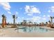 Large community pool offers palm trees and plenty of room to swim and relax in the sun at 804 Buckler St, Summerville, SC 29486