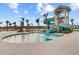 Beautiful community pool with a waterslide, zero entry, and tropical landscaping at 804 Buckler St, Summerville, SC 29486
