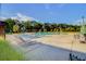 Community pool with a splash pad, surrounded by sun loungers, and manicured landscaping at 804 Buckler St, Summerville, SC 29486