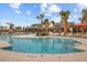 Resort-style community pool featuring sun loungers and palm trees under a blue sky at 804 Buckler St, Summerville, SC 29486