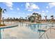 Stunning community pool featuring a slide, palm trees and plenty of room to swim and relax at 804 Buckler St, Summerville, SC 29486