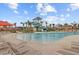 Beautiful community pool with a waterslide, seating, and tropical landscaping at 804 Buckler St, Summerville, SC 29486