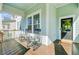 Inviting front porch with rocking chairs, offering a relaxing outdoor space with views of the neighborhood at 804 Buckler St, Summerville, SC 29486