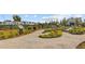 Winding pathways through the community garden with flowers and greenery with bench seating at 804 Buckler St, Summerville, SC 29486