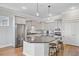 Modern kitchen featuring an island with barstool seating, granite countertops and stainless steel appliances at 804 Buckler St, Summerville, SC 29486