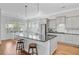 Bright kitchen with hardwood floors, an island with barstool seating, and stainless steel appliances at 804 Buckler St, Summerville, SC 29486
