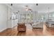 Open-concept living room featuring hardwood flooring, white couches and recessed lighting at 804 Buckler St, Summerville, SC 29486