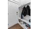Mudroom with a front door, coat hooks, a bench, shoe storage and wood flooring at 804 Buckler St, Summerville, SC 29486
