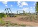 View of the community playground with swing and climbing equipment over mulch ground cover at 804 Buckler St, Summerville, SC 29486