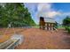 Neighborhood playground with a barn playhouse, swings, and ample space for children to play and have fun at 804 Buckler St, Summerville, SC 29486