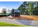 Community playground featuring a barn-themed playhouse, slide, swings, and safety mulch ground cover at 804 Buckler St, Summerville, SC 29486
