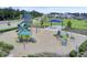 A large playground featuring slides, climbing structures, and a picnic area, surrounded by well-maintained landscaping at 804 Buckler St, Summerville, SC 29486
