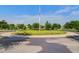 Well-maintained roundabout with lush landscaping and an American flag in a residential neighborhood at 804 Buckler St, Summerville, SC 29486