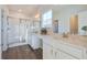 Bright bathroom featuring double sink vanity with quartz countertop, wood flooring and tiled shower at 820 Gentle Breeze Dr, Summerville, SC 29486