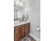 Bright bathroom featuring a modern vanity, sleek fixtures, and decorative accents at 8842 Gable St, North Charleston, SC 29406
