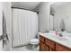 Clean bathroom featuring patterned floors, modern fixtures, and a stylish shower curtain at 8842 Gable St, North Charleston, SC 29406