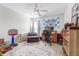 Comfortable bedroom with a ceiling fan, a rug, and an office area for working or studying in comfort at 8842 Gable St, North Charleston, SC 29406
