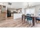 Open concept dining room featuring hardwood floors, and an elegant chandelier at 8842 Gable St, North Charleston, SC 29406
