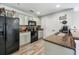 Updated kitchen featuring granite counters, efficient layout, and essential appliances at 8842 Gable St, North Charleston, SC 29406