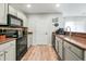 Well-equipped kitchen with a cozy breakfast area and modern black appliances at 8842 Gable St, North Charleston, SC 29406