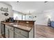 Modern kitchen features granite countertops, stainless steel sink, and open dining area at 8842 Gable St, North Charleston, SC 29406