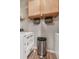 Functional laundry area with built-in cabinets and stainless steel trash can at 8842 Gable St, North Charleston, SC 29406