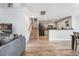 Cozy living area with hardwood floors, a staircase and an open kitchen concept at 8842 Gable St, North Charleston, SC 29406