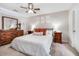 Spacious main bedroom featuring a ceiling fan, comfortable furnishings, and soft lighting at 8842 Gable St, North Charleston, SC 29406