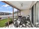 Relaxing screened porch with patio furniture and a grill, ideal for entertaining and enjoying the outdoors at 8842 Gable St, North Charleston, SC 29406