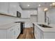 Well-equipped kitchen featuring white cabinets, subway tile backsplash, stainless steel appliances, and quartz countertops at 960 Dusk Dr, Summerville, SC 29486