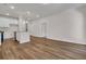 Spacious living area features wood-look flooring, an open kitchen layout, recessed lights, and natural light at 960 Dusk Dr, Summerville, SC 29486
