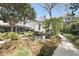 Private backyard featuring outdoor seating and lush landscaping at 99 Logan St, Charleston, SC 29401