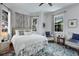 Inviting bedroom features large windows, neutral tones, and comfortable seating at 99 Logan St, Charleston, SC 29401