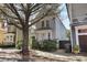 Home exterior with mature tree and landscaping at 99 Logan St, Charleston, SC 29401