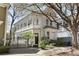 Charming two-story home features a spacious porch and beautifully landscaped front yard at 99 Logan St, Charleston, SC 29401