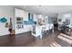 Modern kitchen with stainless appliances, granite countertops, a center island, and beautiful hardwood floors at 99 Logan St, Charleston, SC 29401