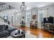 Spacious living room with a modern sofa, hardwood floors, and plenty of natural light at 99 Logan St, Charleston, SC 29401