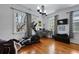 Home office featuring hardwood floors, a large window, and an exercise bike at 99 Logan St, Charleston, SC 29401