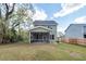 Large backyard featuring a screened-in porch, green grass, and a privacy fence at 103 Rosa Gray Ln, Goose Creek, SC 29445